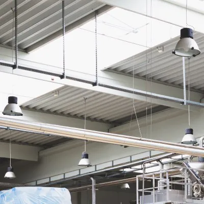 LED gas discharge lamps under a ceiling of a big industry hall